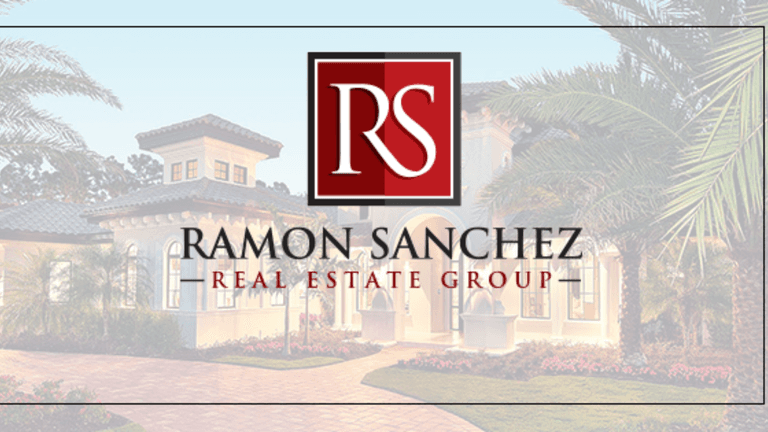 Business professional in formal suit, symbolizing leadership and success in real estate, with a city skyline backdrop