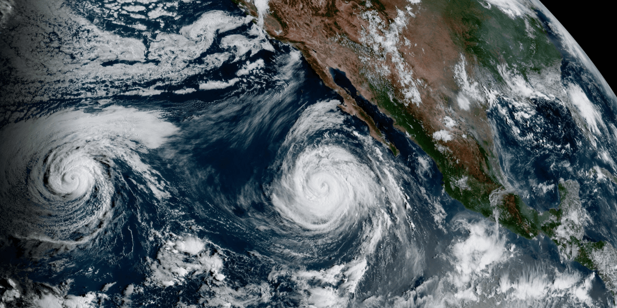 Satellite view of two hurricanes off the coast of Mexico in the Pacific Ocean