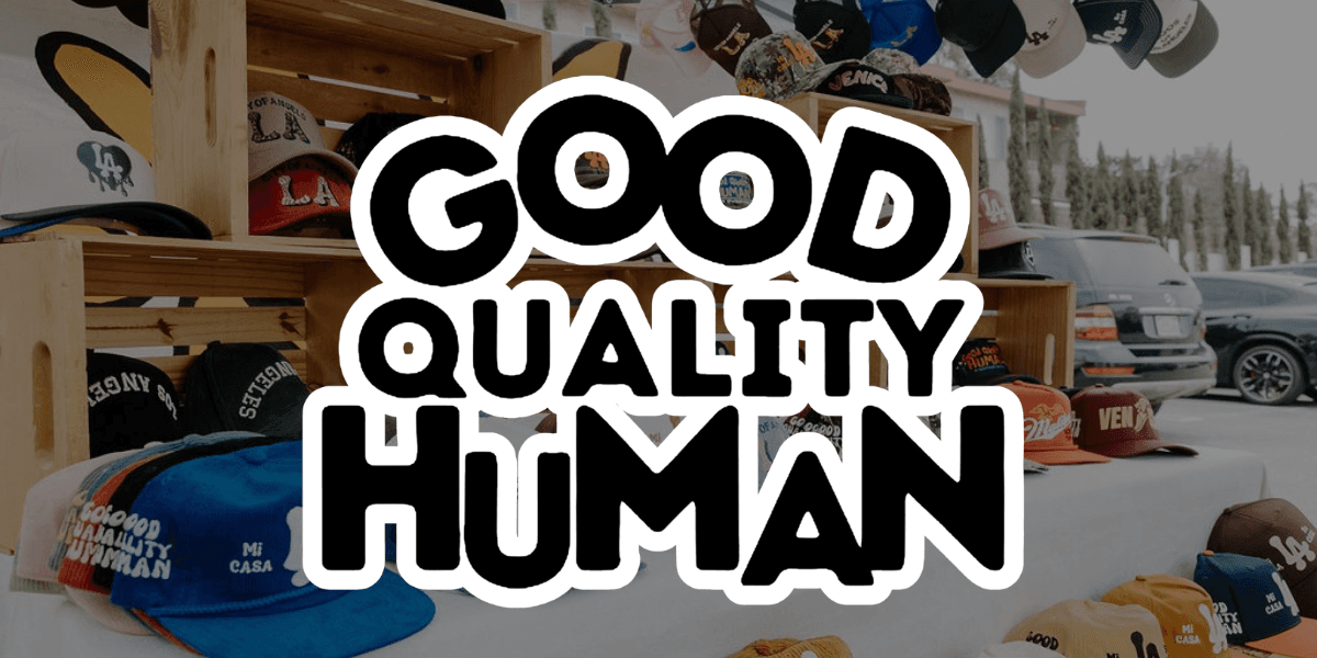 Hats displayed on wooden shelves with bold text overlay reading "Good Quality Human"