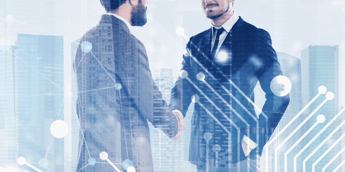 Two business professionals shaking hands with a digital city skyline overlay