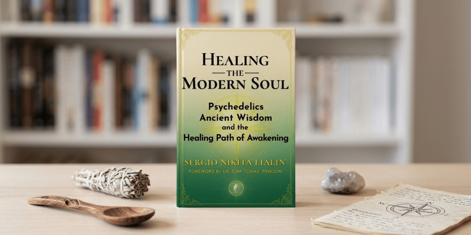 Book titled "Healing the Modern Soul" displayed with a wooden spoon and herbs.
