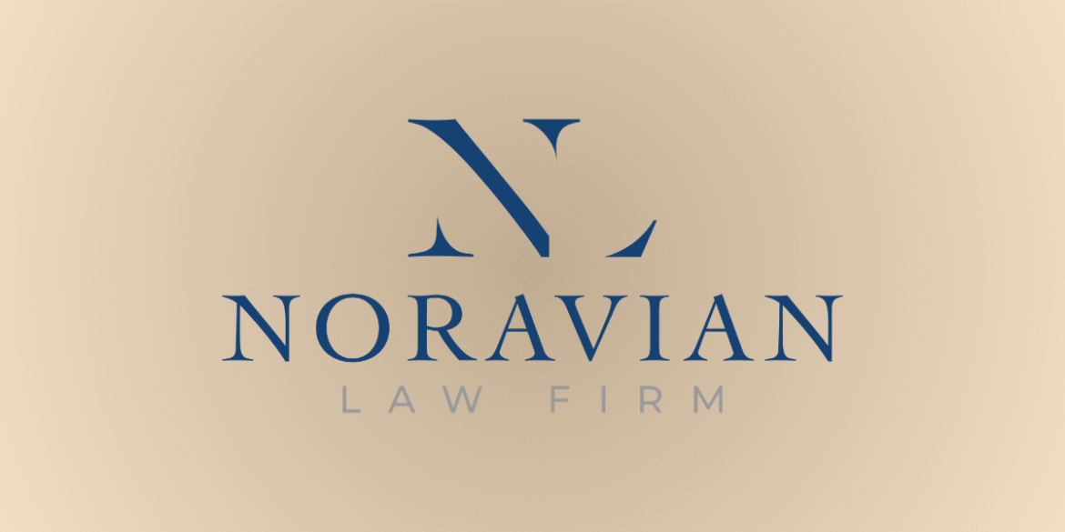 Attorney Carlo Noravian in professional office, providing personalized legal guidance for accident, injury, and insurance claims across California.